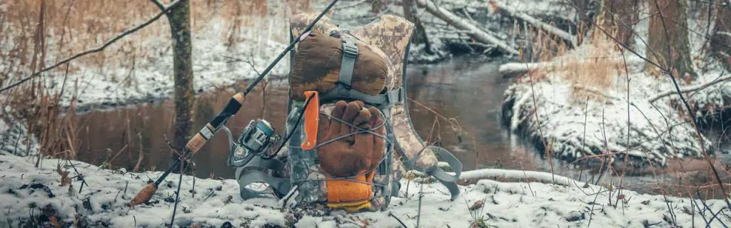 Photo of a fishing backpack in the snow.